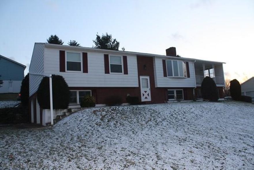 Well maintained 3 bedroom, 3 bath bi level house on a 3/4 acre lot with a beautiful view. Dining room has beautiful cheery wood tongue and groove walls.  This home features a large master bedroom with a private bathroom,partial  finished basement, newer windows, newer carpet, and is handicap accessible. Schedule your private showing today to view this move in ready home.