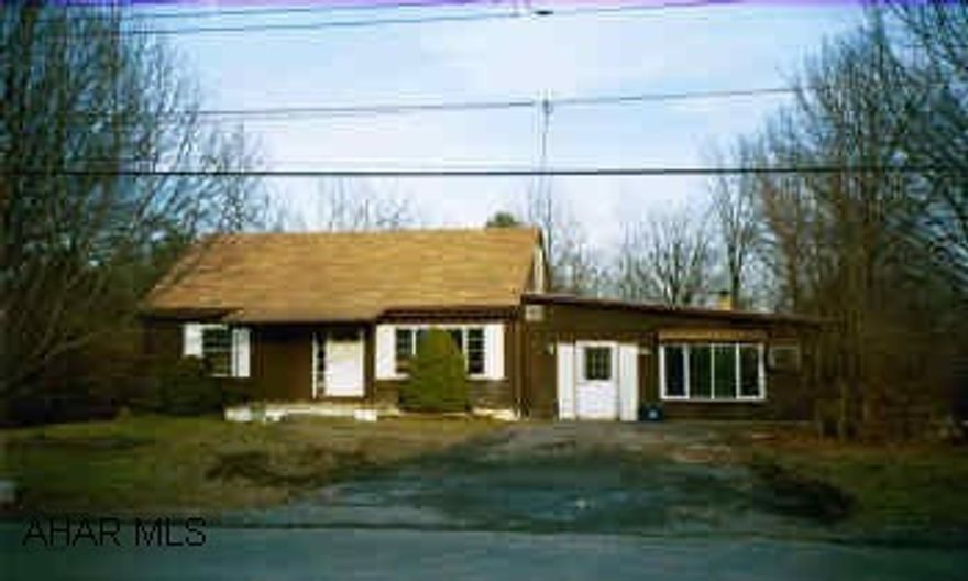 This 1-1/2 story cape cod has great potential with some TLC.