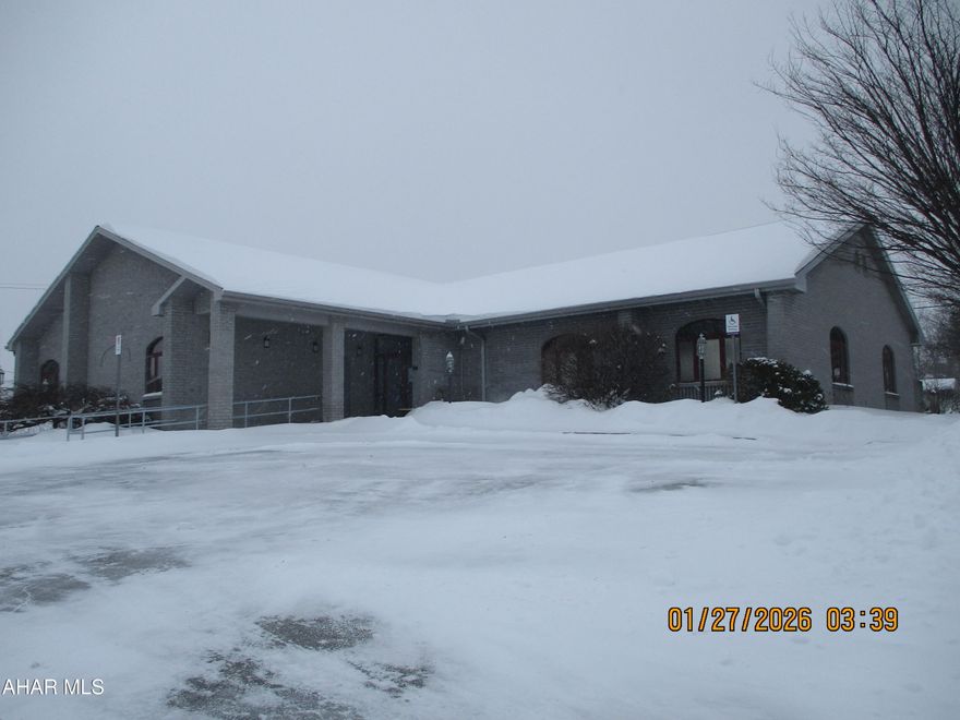 Professional medical building centrally located.  Private offices as well as exam rooms, employee breakroom and large waiting room.  Accessible for handicapped individuals.  Large parking area plus additional parking for employees at rear of the building on unpaved lot known as Logan Avenue, MLS #79314.  Full basement perfect for storage, additional work spaces.