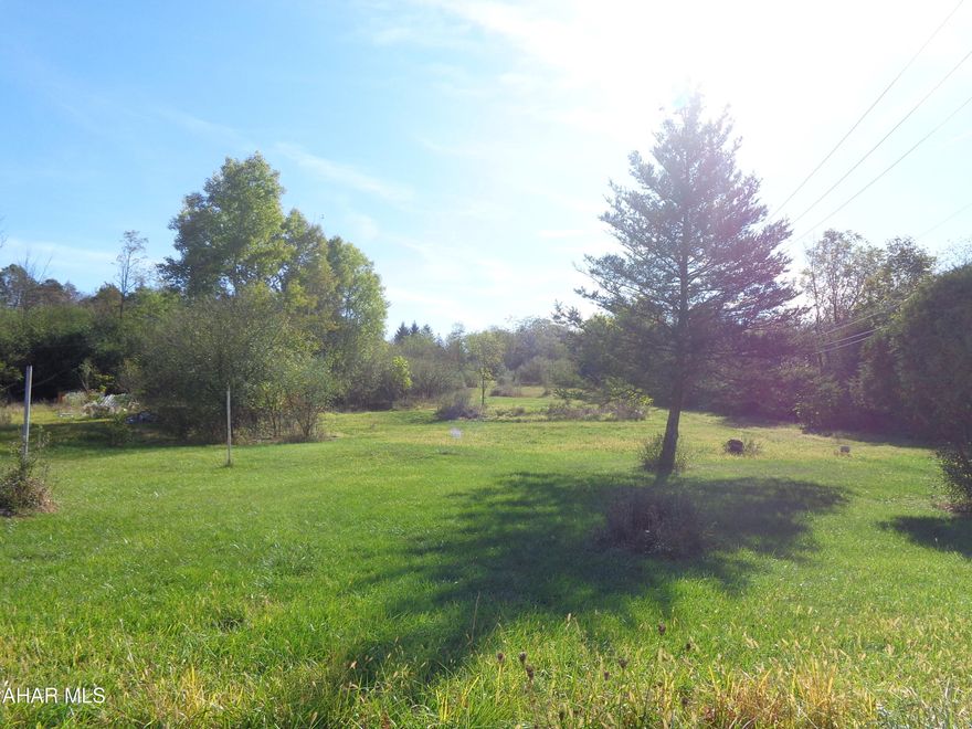This 1.5 acre lot  is a wide open slate to use for storage units, a business, or to build a new home.  Nice lot to build most anything with no zoning in Allegheny Township.   Public utilities available but not connected.  Mostly cleared but some of the lot is wooded.