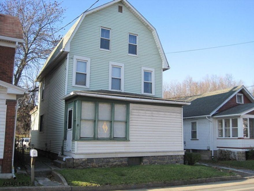 Logan Township--Greenwood--Tons of potential in this three story.  Rear off street parking with fenced yard.  Possible four bedrooms with two bathrooms.