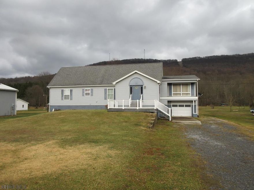 Owner must sell - relocating out of state! Bring offers! Rare find in East Freedom! 1.5 story home on 3.35 acres with trout stream to rear of property and large 30 x 48 steel pole barn with large overhead doors (suitable for RV parking). Features first floor living with beautiful eat-in kitchen with breakfast bar plus dining area, formal dining room, living room with built-in bookshelves and electric fireplace, 2 bedrooms, full bath and laundry room all on the first floor! Second floor has 2 bedrooms (1 captive) with 1/2 bath plus partially finished basement with family room and 1/2 bath. 2 tiered deck, 28' above ground pool with deck, 1 car integral garage plus 15 x 8 storage shed, fenced pet area. This place offers so much - check it out soon!