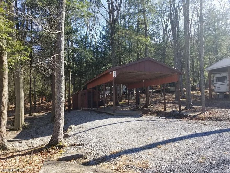 Vacant campsite with pavilion and shed in Glendale Yearound. Property is ready to use now. Electric, water, and sewer are on site. Property is located right across from fishing pond. Glendale Yearound is a gated community, located minutes from Glendale Lake and Prince Gallitzin State Park. Community pool, playground, basketball, tennis, and more.