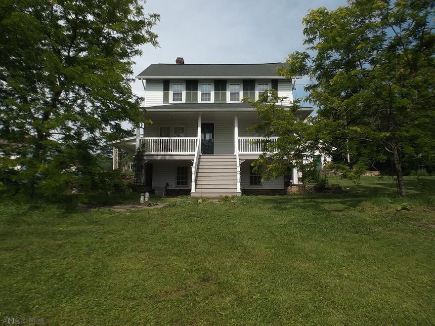 If you are looking for a country home in Juniata....this is it! This home is situated on a large 0.88 acre lot with a large detached 3 car 37x26 garage with an extra 15x15 stall in the back with an additional door. The 3-4 bedroom 3 bath home has an updated kitchen with Hickory cabinets & granite countertops and the appliances stay.  Beautiful front porch updated with trex decking & vinyl railing. Partially fenced yard off of back covered patio.  New furnace in 2014. This home also has central air!  With some updating this could be your forever home! Being sold "AS IS". Seller will make no repairs.