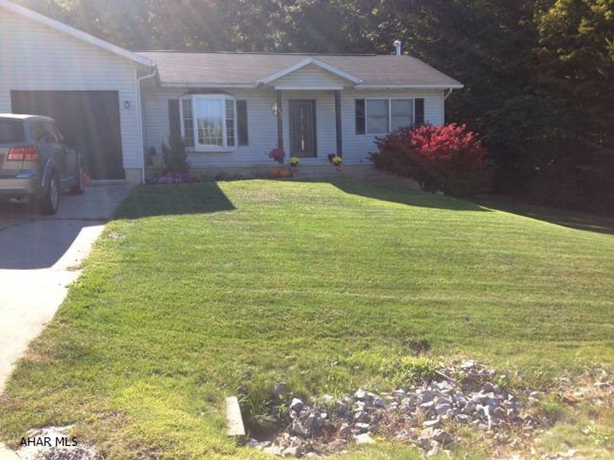 Nestled on an Eldorado mountainside on a cul de sac with views of trains on the adjacent mountain.  Walking distance to Ebner Elementary, minutes to Logan Valley Mall and shopping.  Quiet and convenient. Fully renovated home includes granite counter tops, newer appliances, new heat pump/central air, ceramic, hardwood, laminate flooring with a fully finished walk out basement with wood burner and home gym. Large shed and play set, 16x22 covered deck, fire pit/outdoor entertaining area. 2 car garage, 3 bed, 3 bath. approx. .40 acres.