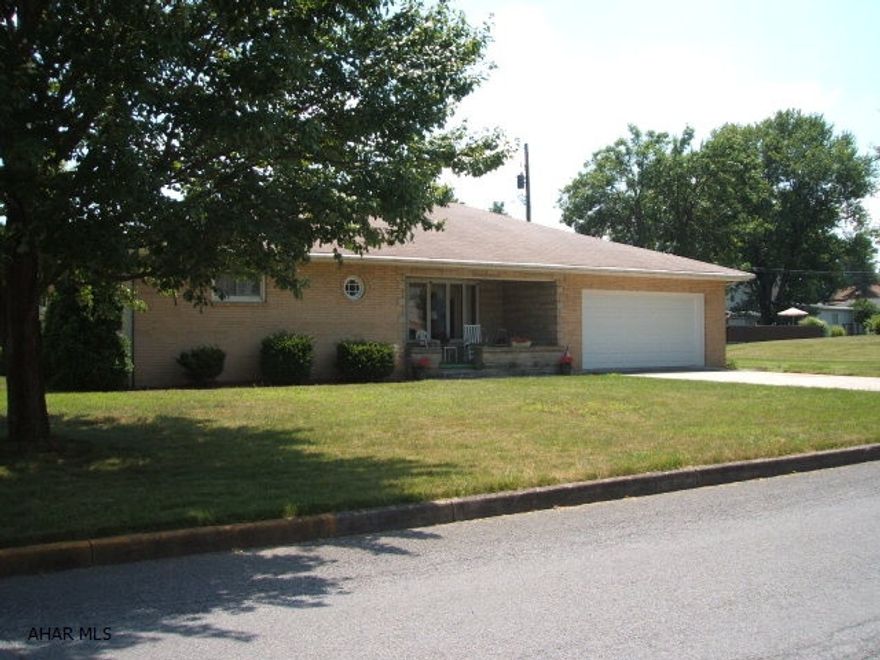 Perfect home for downsizing.  New laminate flooring through Living Room, dining room, and hallway.  Living room is huge with a great bay window.  Closet space galore.  Eat-in kitchen has new counter tops, wall oven, and cook top.  New sliding glass doors in dining room that lead to the sun porch.  Awesome corner lot that is partially fenced.  Low utilities.   Really nice!