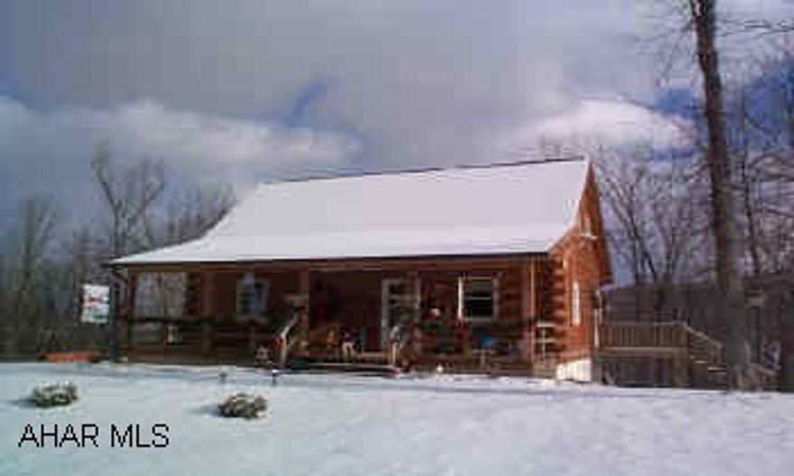 Cozy and pretty too!  3BD, 2BA log home on 1.67 acres, minutes fro Hollidaysburg.  Private setting on dead end road.  Photos at www.CarolGardiner.com Cozy and pretty too!  3BD, 2BA log home on 1.67 acres, minutes fro Hollidaysburg.  Private setting on dead end road.  Photos at www.CarolGardiner.com