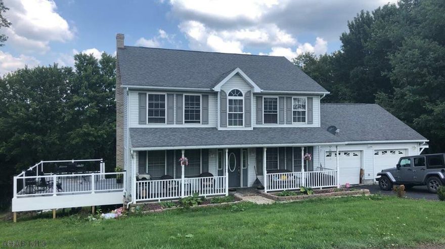 Find this 4 bedroom, 3.5 bath home in a great quiet neighborhood - Woodland Heights - nestled on a hill overlooking all of Gallitzin.  Everything about this home says "new" or updated.  Completely finished basement with a bedroom - or two.  And a theater room.  Check out the children's book-nook alcove down there too.  Upstairs you will find an open concept eat-in kitchen and family room with gas fireplace.  Formal dining room and quiet living room for reading and relaxing,  Master bedroom on 2nd floor has en suite bath.  Most rooms have hardwood floors.  Outdoor patio with pergola.  New composite deck.  Over-sized two-car garage.  Included is an additional .3 acre lot.  Don't wait on this one.  Contact listing agent for your private showing.