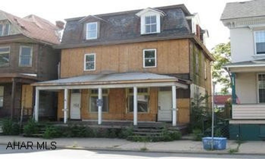 HANDYMAN SPECIAL! DUPLEX PARTIALLY FINISHED ON ONE SIDE. REHAB ON OTHER.