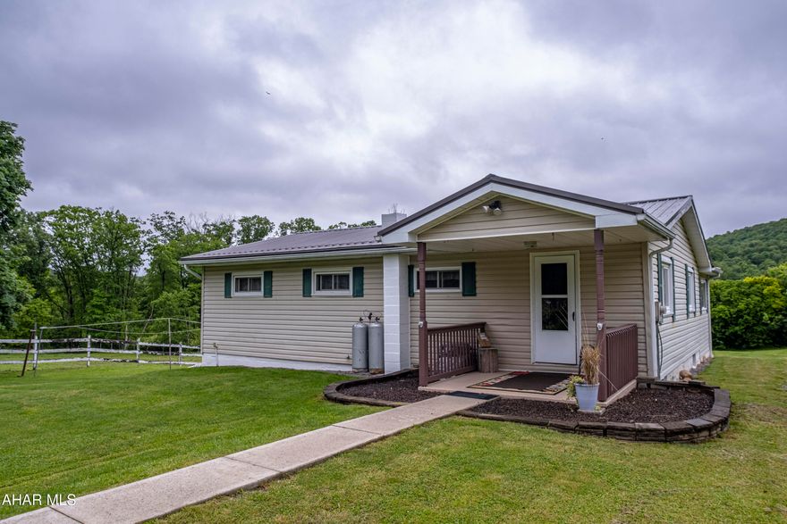 Welcome to your rural oasis! This delightful one-story ranch home offers the perfect blend of comfort and country charm across 2.87 picturesque acres. Inside, you'll find three cozy bedrooms and a full bathroom, along with an accommodating eat-in kitchen ,and a large living area that extends effortlessly to a nice deck, perfect for enjoying views of the expansive yard.   The walk-out basement provides ample extra space and easy access to the outside. For those with a love for horses, this property is a dream come true, boasting a small barn and a securely fenced-in pasture. Schedule a tour.