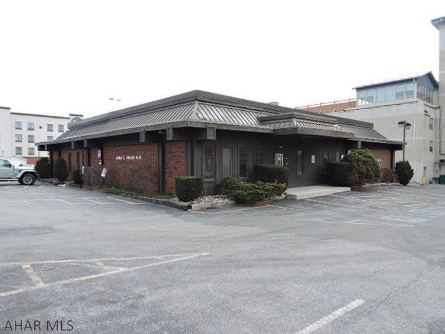 Be a part of the downtown resurgence in this great professional office building.  15 private rooms, 2 reception areas, 1 waiting room, 1 break room, 2 rest rooms+ 1 private rest room. 2 separate entrances could allow for creation of 2 separates offices.  1 half approx. 2175 sq ft the other approx. 2850. Sprinkler system in basement.  Basement is under newer section only.  Easy access & 26 parking spaces plus 3 handicap.  This is a vacant property with an absentee owner.  There will not be any sanitizing being done.  Follow Covid guidelines