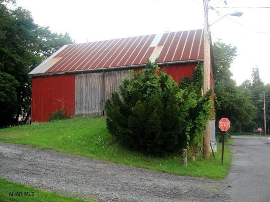 Two-story barn on 0.378 acres in the heart of Everett. Perfect for hobby mechanic, car and/or boat storage, or lots of other possibilities. Unique, old barn that borders the Forbes Trail. Great property at a great price!