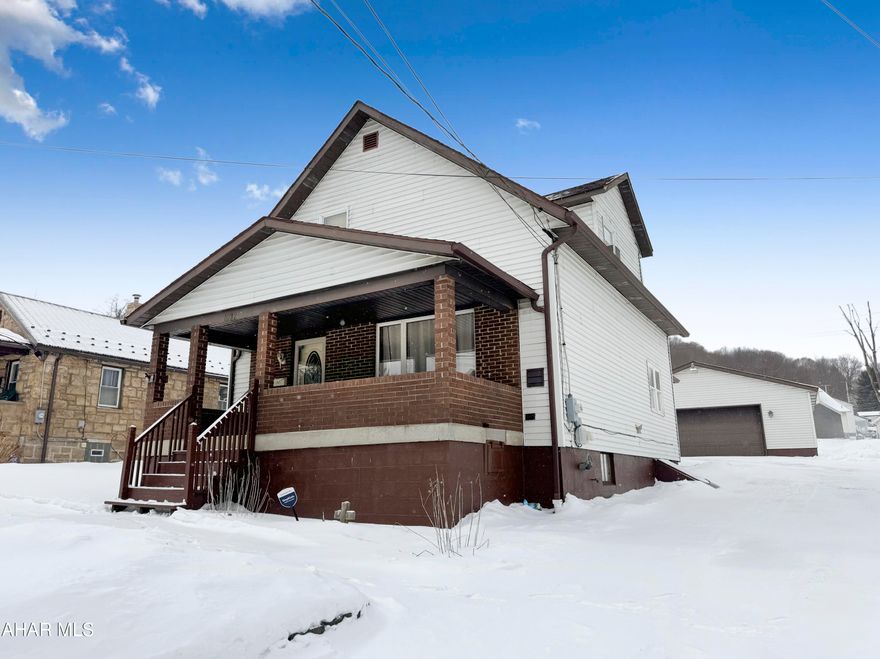 Welcome to 1032 Vine Street, located in the Blacklick Valley School District. This charming & impeccably maintained home boasts an array of wonderful features & recent updates. As you step into the main floor, you're greeted by a spacious foyer that flows into a large living area adorned w/ stunning wood accents & generous windows that fill the space w/ natural light. The eat-in kitchen is inviting & thoughtfully designed, complemented by an updated three-quarter bath, convenient first-floor laundry, & a generously sized bedroom which once was the dining room. Venturing upstairs, you'll find an additional updated three-quarter bathroom along w/ three more spacious bedrooms, providing ample space. The unfinished basement offers excellent storage options & houses a newer gas furnace & hot water tank. On the exterior, you'll appreciate the covered front & rear porches, a large paved driveway, & a sizable three-car garage equipped w/ power. Don't miss out on this exceptional opportunity—call today for more information!