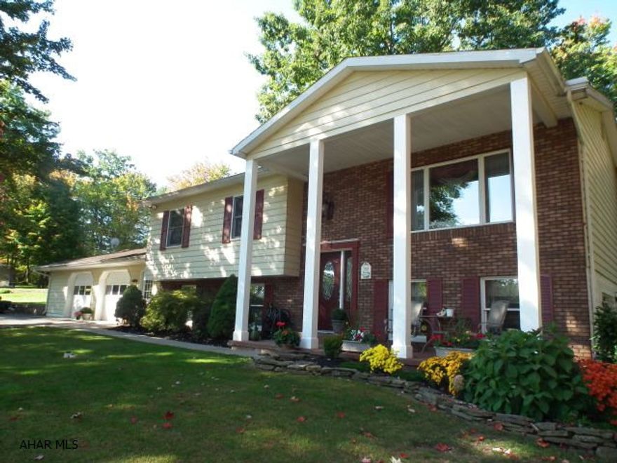 This home is cradled in a wooded setting on 1 acre (.989 acre) on top of Carson Valley Road. Over-sized 2 car garage is great for vehicles + workshop area, storage in ceiling. Spacious kitchen has plenty of cabinets + eating area off kitchen with sliding doors to a perfect setting for enjoyment on deck. Finished basement extends family enjoyment or entertaining with fireplace + walk-out. Don't miss this one! All utilities average $275.