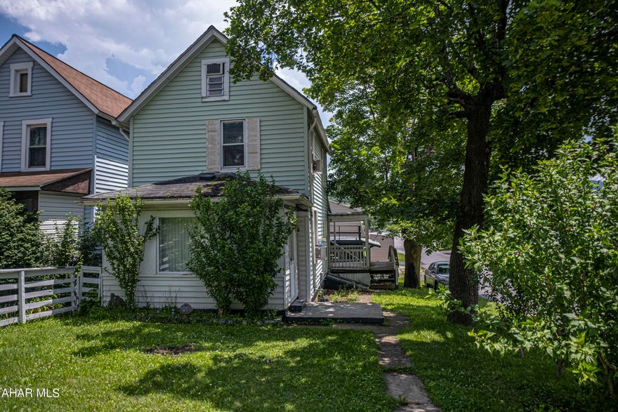 Great two story home with a large garage on a corner lot. This home features 2 bed rooms,  one and a half baths, kitchen,dining room and first floor laundry with a half bath.  Walk up attic could be a 3rd bedroom. Above the garage could be made into an apartment or storage. Off street parking. Motivated Seller. Schedule your tour.