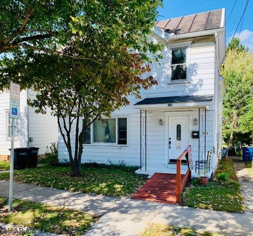 Residence or Income Producing Home. The home is set up as a residence and Multi Unit apt. 1st floor or 2nd floor units. Large foyer and back porch. The home is heated with oil hot water and the upstairs stove is natural gas. The home can be converted to natural gas.  This home was built in the 1800's and exterior is log. The yard goes to the alley and you have off street parking. Enclosed back deck for relaxing. The bathtub upstairs was remolded by Bath fitters.  2-100 amp electric service. Water and sewer are not separated..