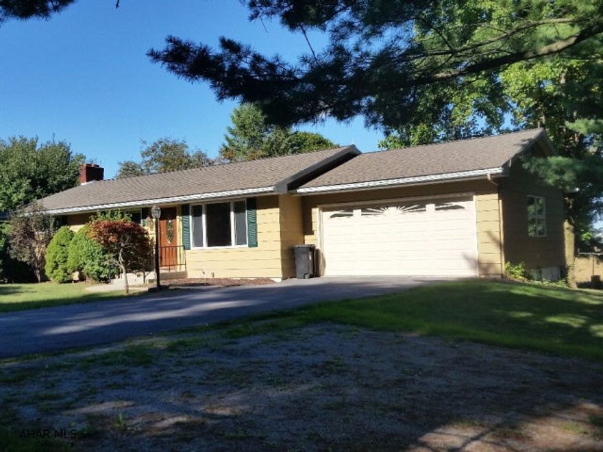 3 Bedroom rancher with hardwood floors, central air, family room w/fireplace, great view from back porch, 2 car garage.  #J-355 2016 taxes = $1,851; reassessment estimate 2017 taxes = $1,549.