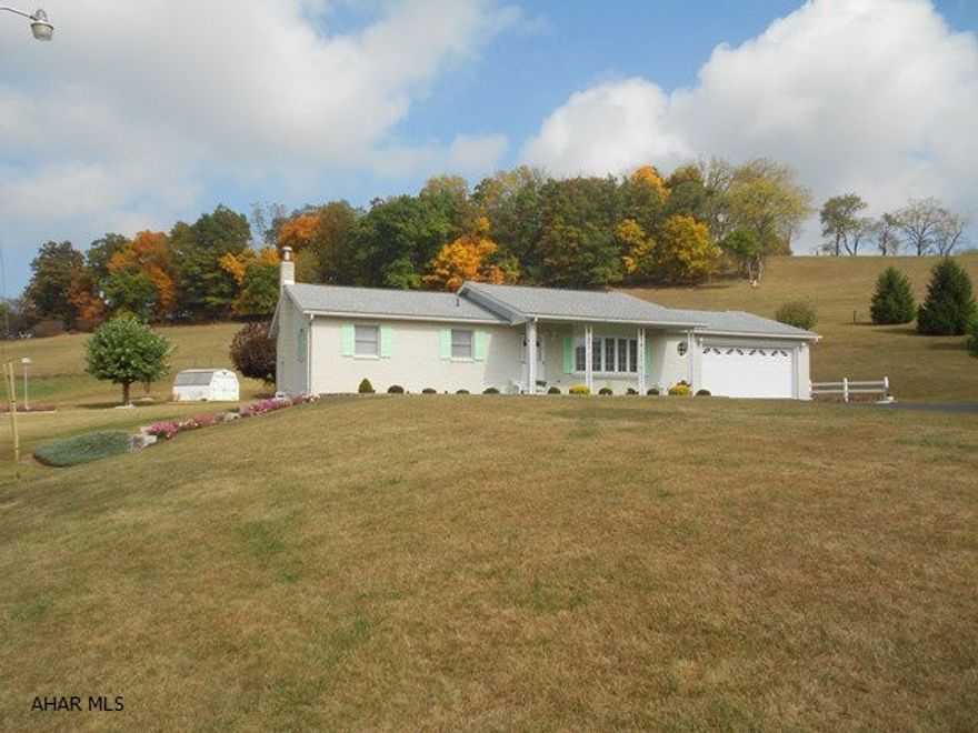 Views, views, views with this brick ranch home and 2 car attached garage. Three bedrooms, 2 full baths upstairs. Finished basement w/ gas fireplace. 1/2 bath in basement. Lovely landscaped yard, small shed, paved driveway all of this setting on 12.6 acres. Beautiful!