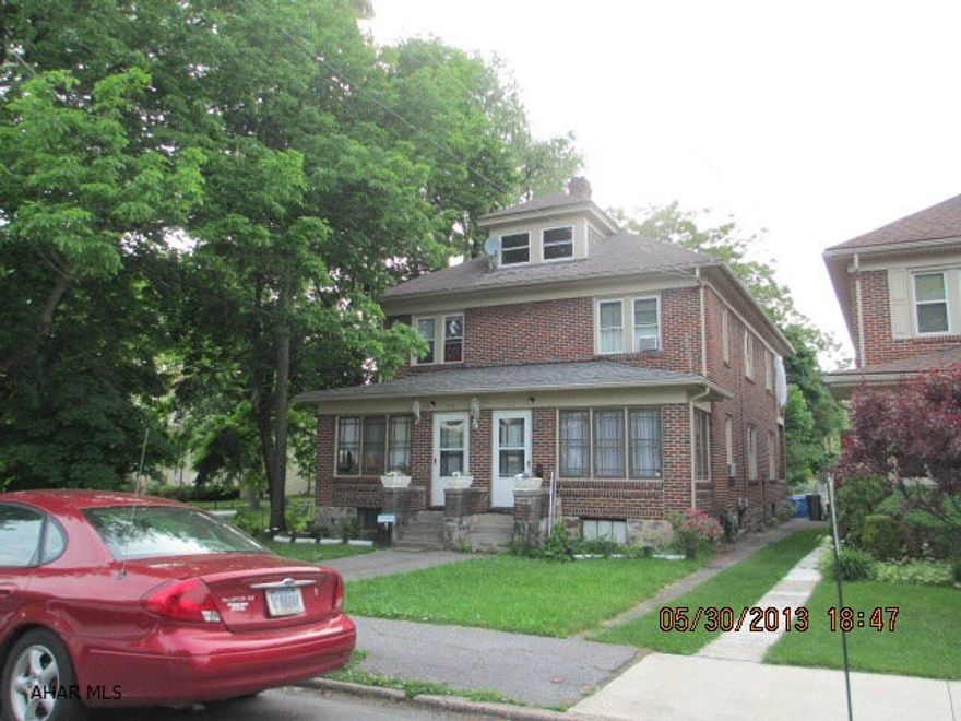 Brick side by side duplex.  Live in one side,rent the other.  Beautiful large lot. New HW heaters both sides, New windows and furnaces in both sides (6 yr). Tenants pay all utilities, including trash. Covered pavilion on left side of property.