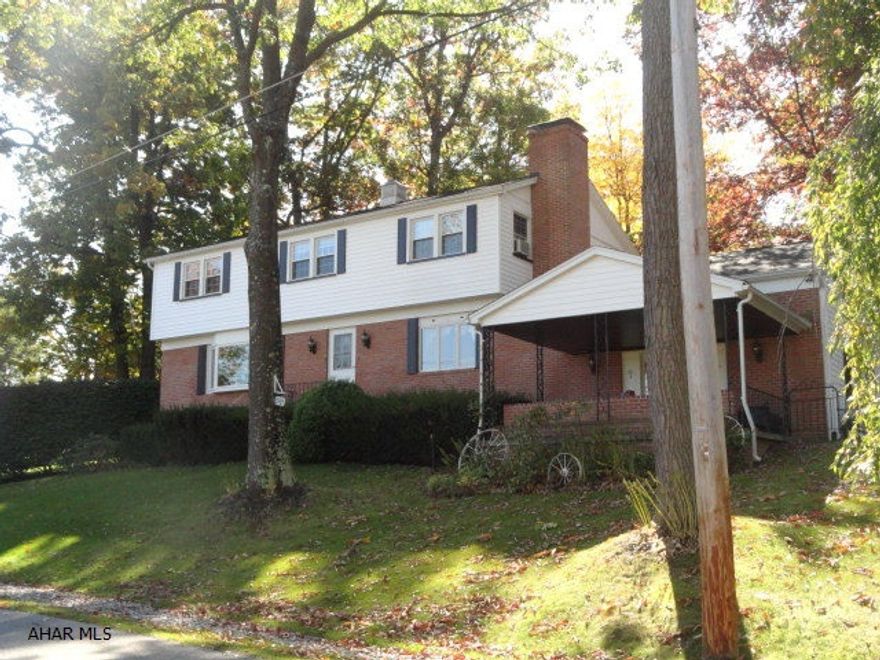 Large two story house, family room addition with stone F/P and built- ins. Five bedrooms for the growing family. Home is on 3 lots with inground pool. Total GLA includes heated 18 x 24' sunroom off dining room. Owner says there is hardwood floors in living room and dining room under carpet. It appears there may be hardwood under the carpet in some of the bedrooms because there is oak hardwood in closets. New Furnace. Public sewer to go in sometime in 2015. Must look inside!