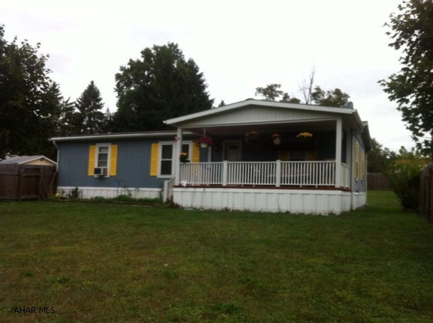 3 Bedroom, 2 bath 26x48, 1987 Doublewide on nice fenced owned lot with 26x26 attached 2 car garage. Newer hot water tank, new shower/tub unit. Newer flooring throughout, laminate, tile and carpeting. Freshly painted exterior.