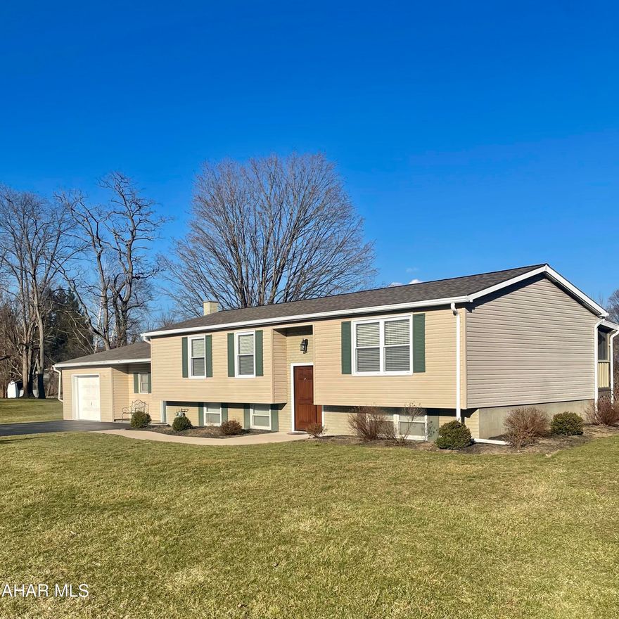 Beautifully maintained 3 bedroom, 1.5 bathroom bi-level home in Hollidaysburg Area School District near Foot of Ten Elementary School. This home features newer carpet/flooring throughout, neutral colors, and an inviting sunporch to enjoy the breeze while having your morning coffee. The finished basement is perfect for a 2nd family room and entertaining guests. This home feels bigger than it looks as it has many bonus spaces for easy to access storage and a bonus room with a 1/2 bath attached that could be used for a recreational room, home gym, office, craft room, workshop, whatever would suit you! Through the bonus room there is a separate laundry room and then a large breeze way leading to the garage, perfect for all your storage needs. All this located on a large flat .53 acre on a quiet road, perfect for your family and/or pets! Turn the key and move right in!! This is a must see - schedule your showing today!!