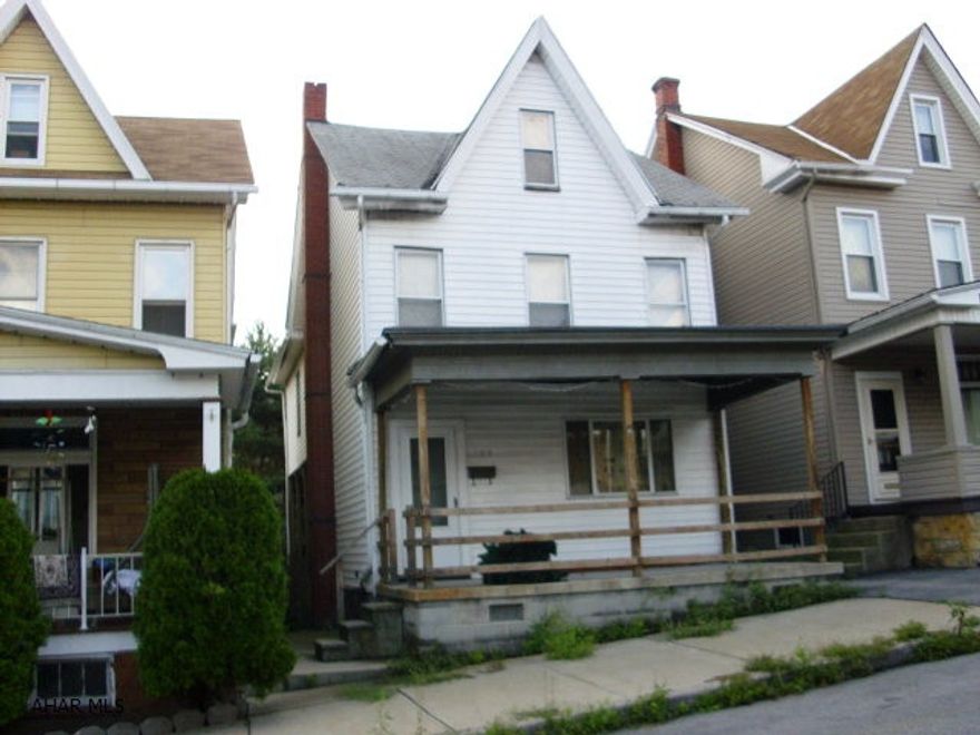 Large 2.5 story house in need of TLC. Good neighborhood. Hot water furnace is 2 years old. Needs roof.