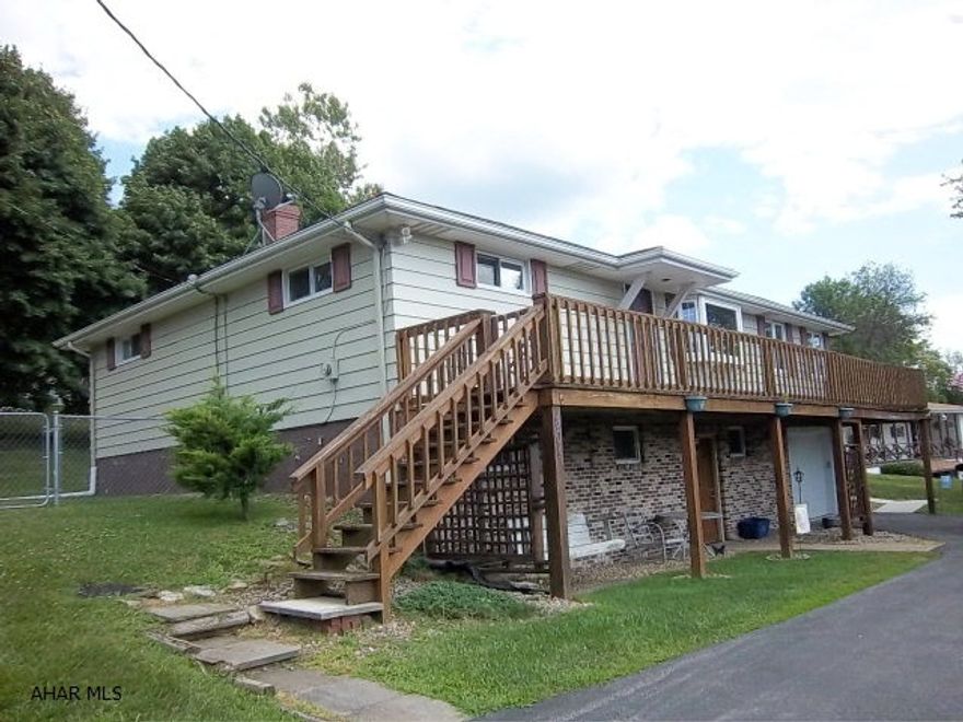 Logan Twsp. Very spacious raised ranch. 4 bedrooms, 2.5 baths, one car garage. Above ground pool, new covered patio, furnace and C/A. Covered porch in rear and house width deck on the front with mountain views. This home has it all with formal dining room, huge living room & kitchen and lower level family room. Fenced in yard, newer windows and roof.