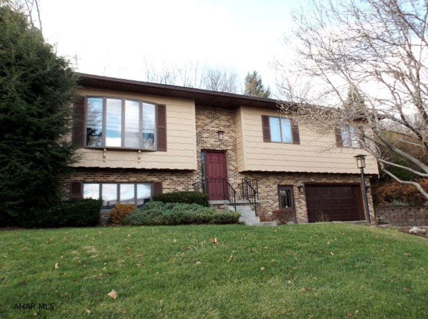 Bi-level with 3 bedrm, 2 baths on a large lot with an in ground pool. Spacious living rm,formal dining rm. Kitchen with eating area.  Slider out to the patio. Main bathroom just remodeled.  Large family rm with gas fireplace. Over sized walk-in closet. 1 car garage presently being used for game rm but could be easily converted back to  garage. Close to Logan Valley Mall and schools.