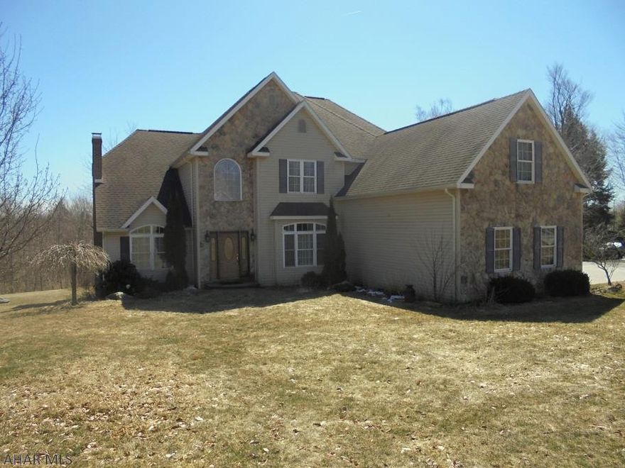 Custom built 2 story home with 9.6 acres of land that borders state game lands. This home has it all! 5 bedrooms, possible 6th in basement. 4 baths, great room, formal dining room, butler's pantry & more.  Ceramic tile & hardwood floors. 3 car attached garage.