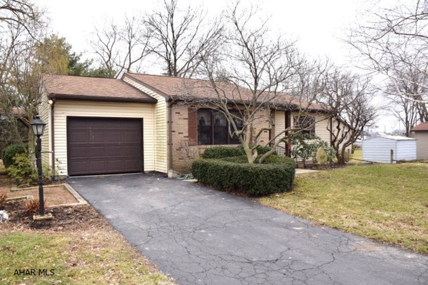 Adorable ranch home in move-in condition.  All new carpeting, ceramic tile in kitchen and baths, central air.  Large bedrooms with good closet space.  Three season sunroom, brick patio.  Unfinished basement, easily finished.  One car attached garage. Pretty back yard.   Convenient location.