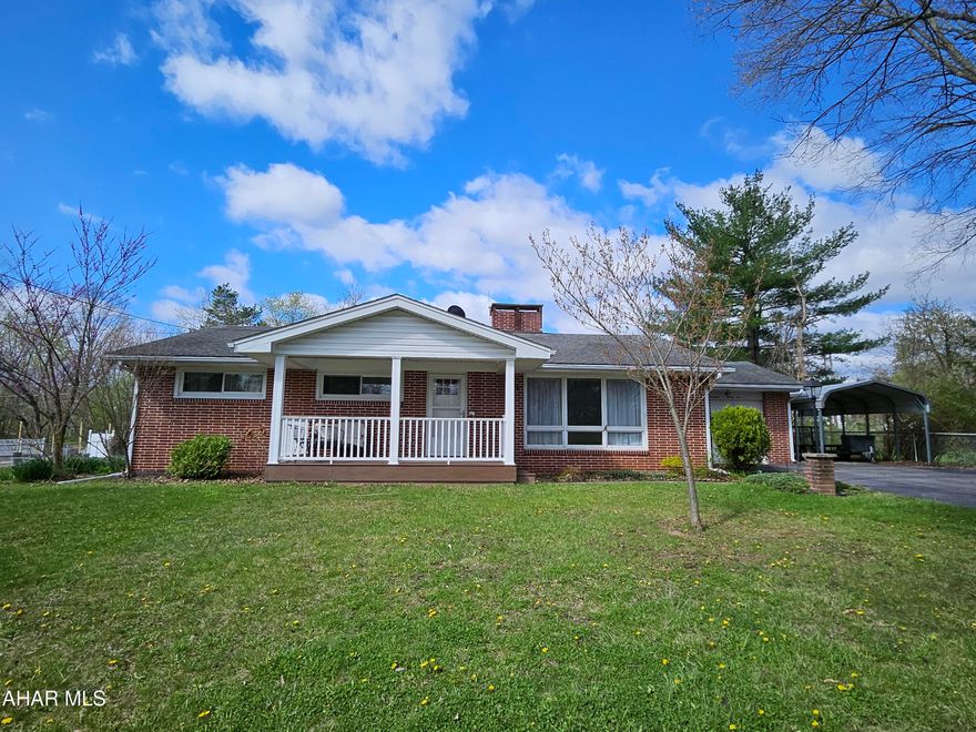 Location, location, location!  This exceptional all brick one story offers a beautiful sun room, double sided gas fireplace, newer eat-in kitchen with all appliances and large bedroom sizes.  A convenient 1/2 bath on the main floor, beautiful hardwood floor and a family room in the walk out basement!  Huge storage area/workshop is also in the basement.  Abundant garage space with 1 attached, 1 carport, 1 detached and a large shed with a beautifully landscaped yard.  Covered Trex deck, gardens. The well in the back still works so you have plenty of water for the flowers!  Don't miss this opportunity!