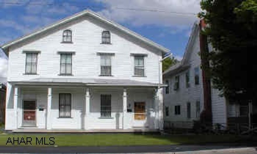 2 1/2 story frame, 1/2 double house.