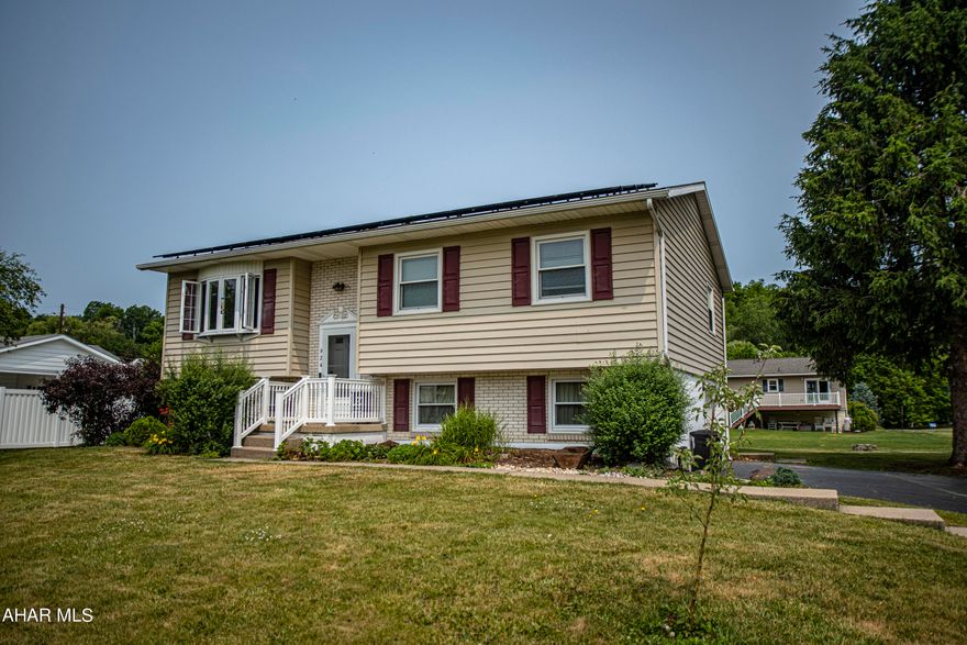 Don't miss out on this bi-level gem in the heart of Duncansville borough! This 3 bedroom, 2 bathroom home boasts so many fresh updates including laminate flooring throughout, remodeled bathroom, 3/4 bathroom added, new furnace, new water heater, new windows, refrigerator, dishwasher, & microwave - the best added feature is the solar panels on the roof making the electric bill next to nothing! The layout is perfect for any family featuring a large living room with bay window open to the dining room & kitchen with a sliding glass door out to the covered back deck - a perfect spot for relaxing with your morning coffee. The basement has a finished family room / bonus room that has the newly added 3/4 bathroom attached. The large 1 car garage has extra space for the laundry, work bench, and all the storage area you would need. The large flat backyard is perfect for your kids, pets, or entertaining guests! It's within walking distance to 2 neighborhood parks, 2 picnic pavilions, 2 baseball fields, and a fishing stream. Schedule your showing today!