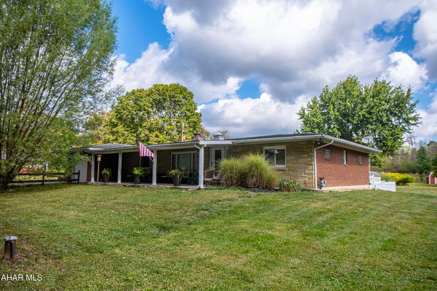 Welcome to this charming and well-maintained 3-bedroom, 2-bathroom brick ranch home, ideally located in the desirable Hollidaysburg School District. Nestled on a spacious and level lot, this single-story residence offers both comfort and convenience—just minutes from  shopping, dining, and more.

Step inside to find a bright and inviting living room featuring a stunning stone fireplace and a large bay window that floods the space with natural light. Hardwood floors flow throughout the home, enhancing the warmth and character of each generously sized room.

Enjoy the convenience of a spacious kitchen and dining area as well as a relaxing deck overlooking the backyard. Additional features include central air conditioning, a one-car garage, and two storage sheds for all your outdoor needs. Don't miss the opportunity to own this move-in ready home in a fantastic location.