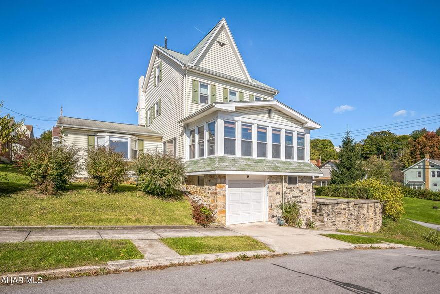 Welcome to this beautifully renovated 3 story traditional-style home, perfectly situated on 4 spacious city lots. The first floor has been completely remodeled with elegant hardwood floors and features a sophisticated living room with pocket doors and French doors. The brand-new kitchen is equipped with top-of-the-line GE appliances, including a microwave, oven, refrigerator, and dishwasher, as well as a Maytag washer and dryer. The first floor also includes a fully updated 3/4 bath for convenience. Upstairs, you'll find three cozy bedrooms 2 of which have just been updated with a new carpet and paint and a full bath.  These 2 bedrooms were once a large bedroom and can easily be converted back to one.  The finished attic offers a walk-in closet and additional space for your needs. This property boasts a range of versatile structures and amenities: a built-in garage, a heated detached garage, a 'possibilities room' (ideal for a workshop, she-shed, or additional storage), a shed, and a charming dollhouse/pool house. Enjoy the outdoors with an indoor & screened patio, an outdoor patio, and a pool surrounded by a wraparound wooden deck. The detached garage has it's own breaker, propane gas and water can easily be installed.  There is quartz in the garage that can will be left to the new owner to update the upstairs bathroom.  The pool equipment is included or the pool can be taken down. A new pool is not very costly and be placed for under $3000.  The home also benefits from a new roof installed in 2018, ensuring peace of mind for years to come. Don't miss this unique opportunity to own a blend of traditional charm and modern convenience in a spacious and versatile setting.