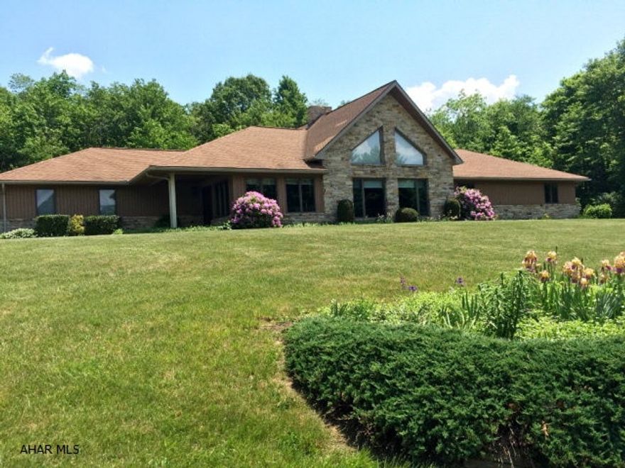 Custom built contemporary home on 10 very private acres. The home's design takes in exceptional vistas that surround the home at every angle. The centerpiece of the home is the floor to ceiling stone fireplace that fronts both the kitchen and great rooms. Beamed ceilings combined with soaring cathedral ceilings, solid black walnut cabinets, a loft with stone wall, bonus room surrounded by windows and a fabulous screened in porch make for a terrific home. Master has two walk in closets & huge bathroom. Main floor laundry, attached two car garage plus additional separate garage. Located in historic Bedford County, close to PA Turnpike, I-99 and Lincoln Highway.