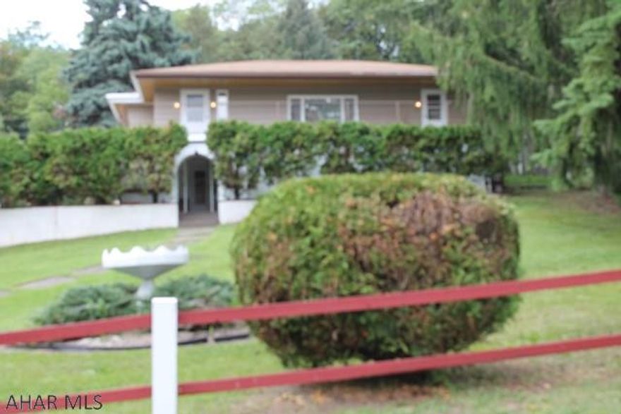 In search of a home to match your imaginative personality?  Starting with an enclosed lower patio featuring unique sliding windows & lights, diner style seating, swing and 2 sets of sliding glass doors, one leading to an outdoor cooking area. Within the porch area the stairs lead to an upper level sun deck. Outdoor entertaining has never looked like this. To complete the lower level you will find a spacious work room to serve any hobby needs, from restoring antiques to classic cars. Need more living space? This room could easily be converted into addition bedrooms or living area. The upper level includes and eat in kitchen, laundry room, full bath, bedrooms and living room. Intercom system and ducts for central vacuum top off this unique home.MOTIVATED SELLER