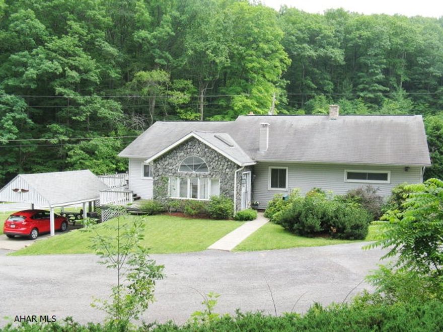 Large rancher on 1.6 Acres.  Private Setting.  In-ground Pool with new liner.  Large finished lower level with summer kitchen.  Over-sized 2 Car Detached Garage plus carport.  Deck (with new flooring).  Minutes from Altoona Campus.