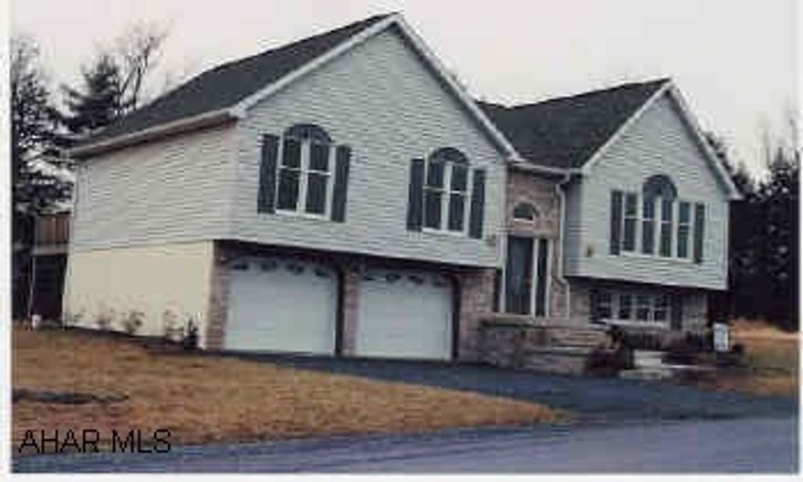 Split entry with alpine roof design, Vaulted ceilings, large familyroom with gas log fireplace. Master bedroom and diningroom open onto deck.