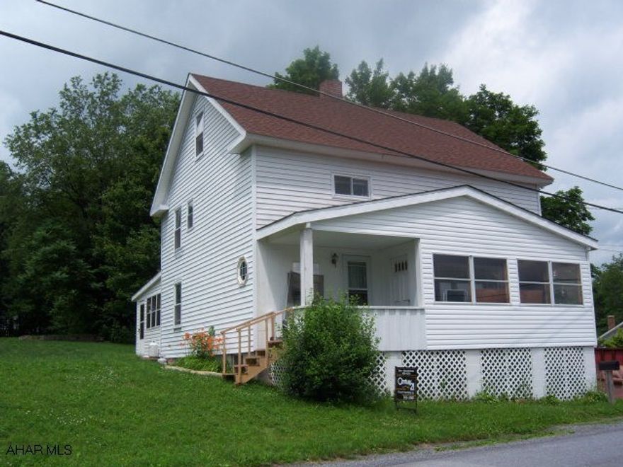 Nicely renovated throughout. Three full floors. 3-5 bedrooms. First floor has bedroom/ with bath. Nice enclosed rear patio/ porch combination, furnace uses wood, coal or oil. lovely private backyard. New carpeting throughout.