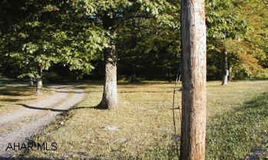 Nice level piece of ground across from BelAir Estates. 950+- of road frontage. Great site for warehouse, storage, shed, auto sales, etc... VACANT LAND           Nice level piece of ground with lots of road frontage. Sewage is available but not currently conected on site.