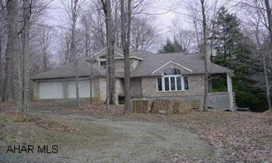 What an opportunity!  Finish this one to your specs.  Building supplies are included with sale.  No heating system.  See agent for sales addendums. What an opportunity!  Finish this one yourself - building supplies are included with sale.  Great lot and location.  See agent for sales addendums.  HOA fees are $367.05 per year.  Quarterly fee for water is $56.31 and $76.32 for sewer