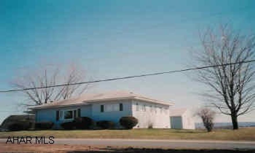 81 beautiful acres with a small ranch home, detached garage and barn.