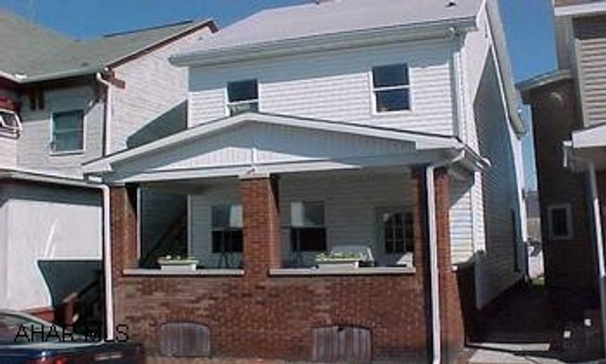 5 bedrooms and 2 kitchens. Well maintained. Single family home that can easily be converted back to a duplex.