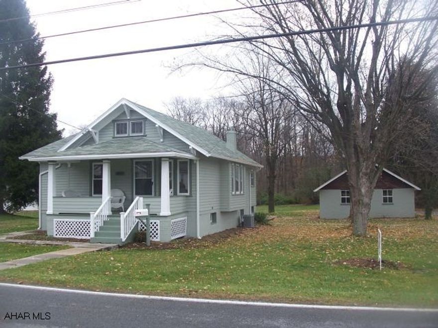Lovely 2 Bedroom Ranch on 1.15 acres. Beautiful Flat Wooded Lot, 2 car Detached Garage. Home Totally Remolded, New Kitchen, Bathroom, Flooring, Furnace, Central Air, and Electric.