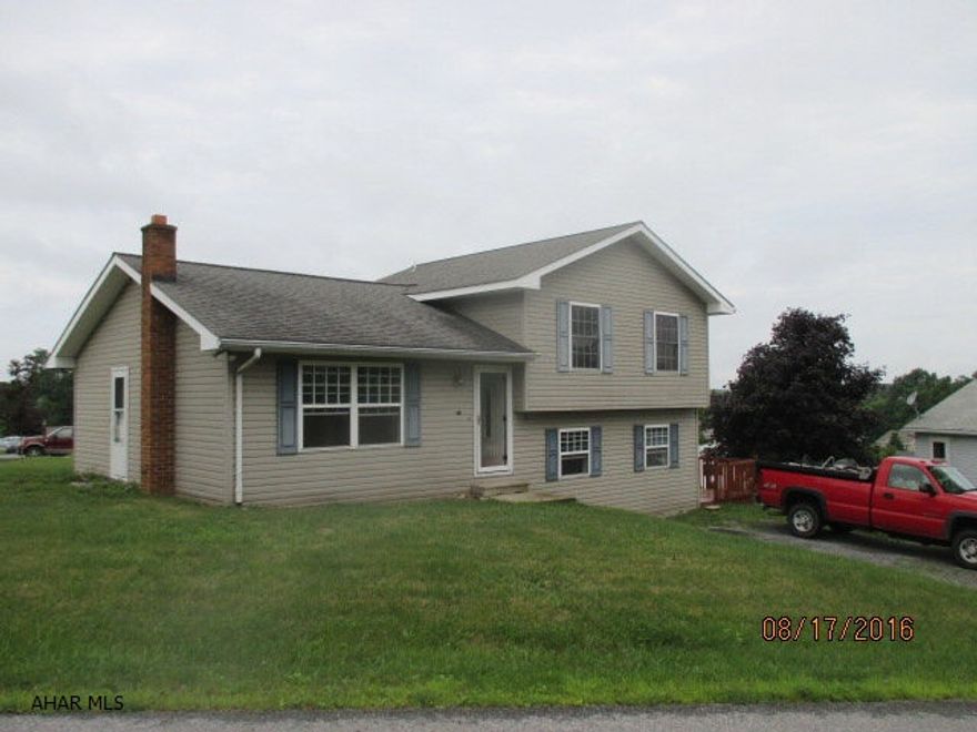 3 bedroom 1.5 bath home with finished lower family room.  Additional flu off of main living room for alternate heat source.