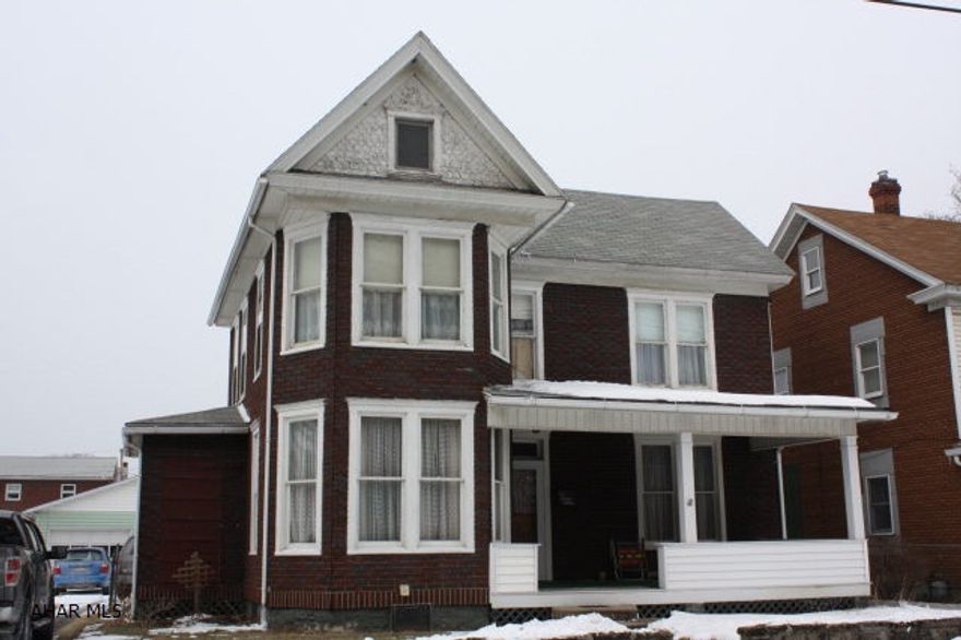 If you want in Bellwood with private options, take a look at this property.  It sits right on the edge of town across from a small wooded area and no neighbors on one side.  The house has an updated kitchen and very large rooms.  The yard is fenced and has a 28'x24' 2 car garage with more then enough room for workbenches and extra's. Sit and enjoy sunrise's and sunsets on the covered front and back porches.  Make this house your home with your own personal touch, call for a showing now.  New Roof was installed in 2005, updated electric to 200AMP and Breakers.