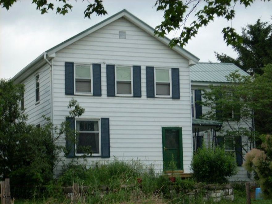 Incredible Sinking Valley home with a great history!  Built in the 1880's this spacious 2.5 story home has 2684 sq.ft, a great master bedroom (42x22) with vaulted ceilings and fireplace, a large deck (28x16)overlooking 1 acre of peace and quiet.  The Real Estate taxes are $308.00  per year.  home has had some updates in kitchen and bath.  200 amp service.