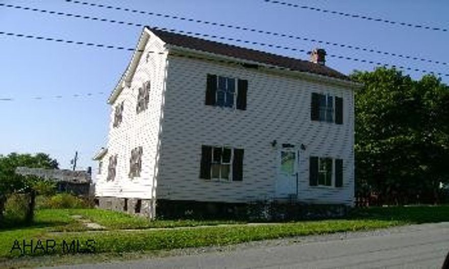 Great starter home or investment property - Interior is unfinished - 2 Story frame/vinyl house with annex - Level double lot with 1 well and public sewer - Fronts Vine Street and Sugar Pear Lane. From Bedford, take Rt. 30 East to Schellsburg - At traffic light, turn right on to North Market St/Rt 96 North - Turn left on to Vine Street - Property on left - Sign in yard.